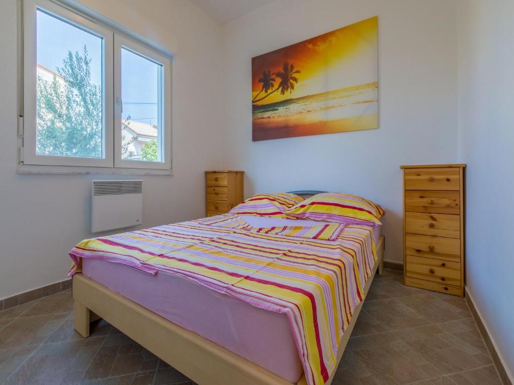 Postel nebo postele na pokoji v ubytování Apartments Ksenija