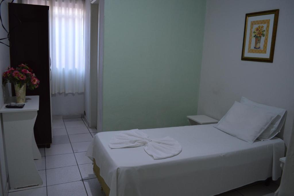 Postel nebo postele na pokoji v ubytování Hotel Confort Maringá