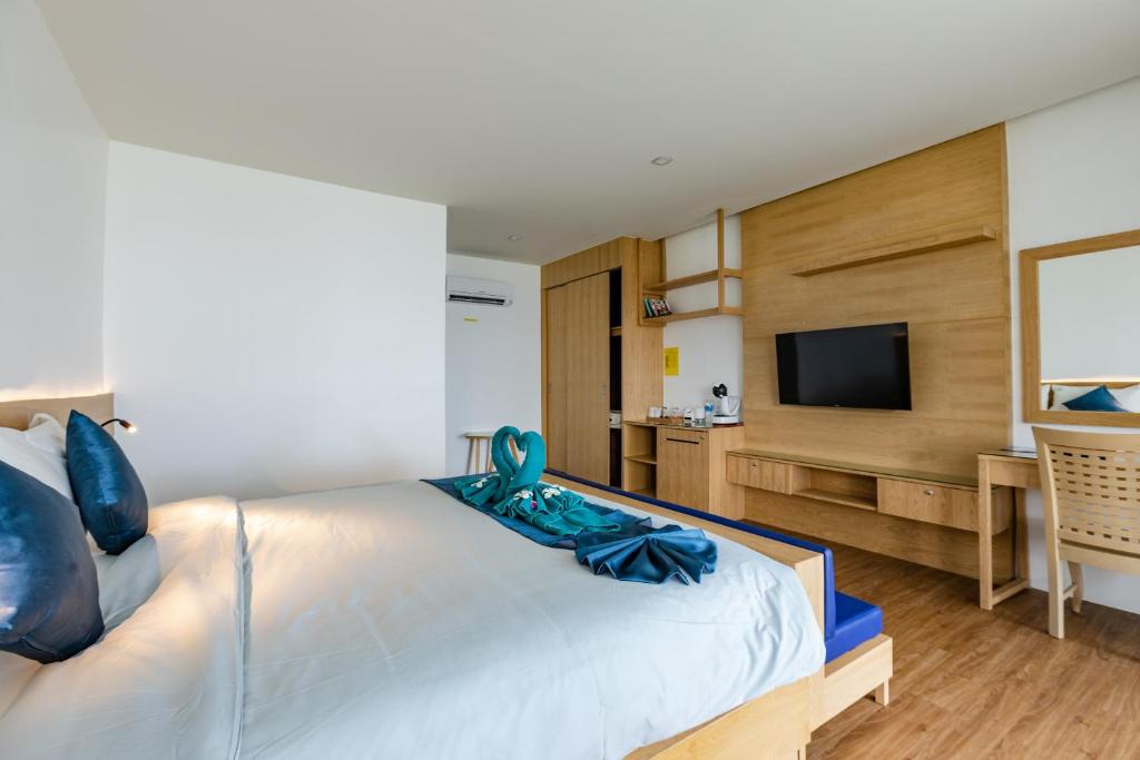 Postel nebo postele na pokoji v ubytování Paradise Resort Phi Phi