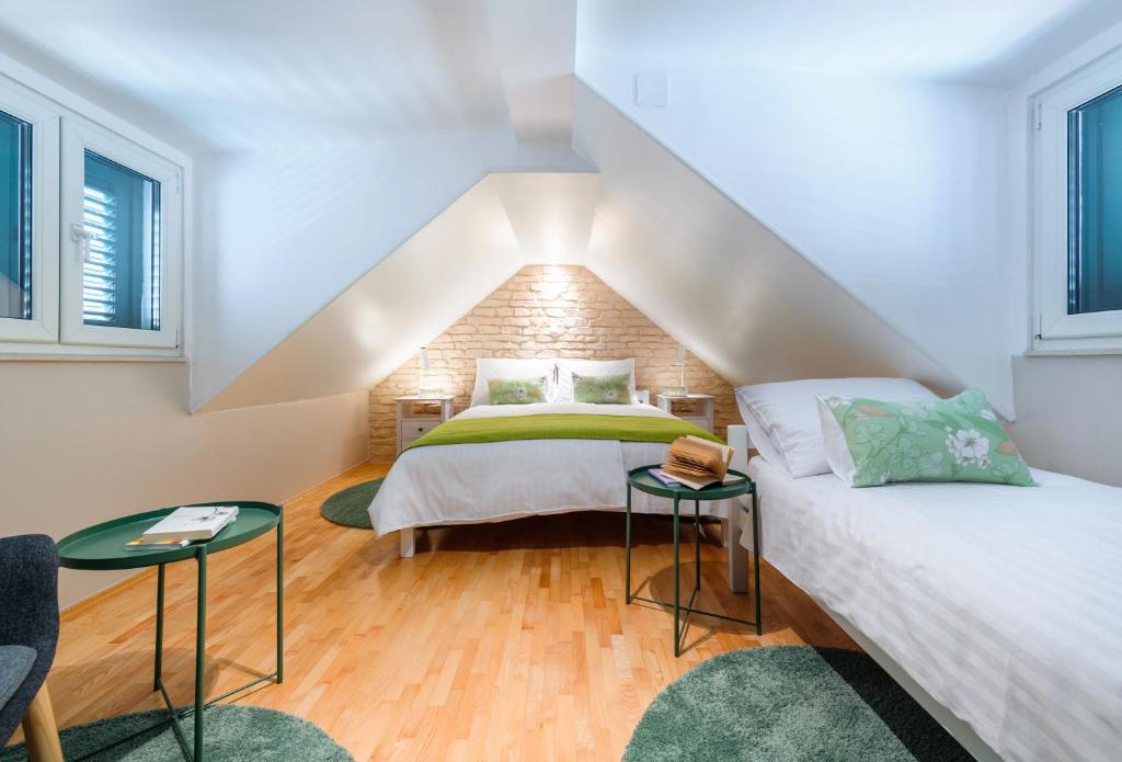 Posteľ alebo postele v izbe v ubytovaní Apartments Villa Mak