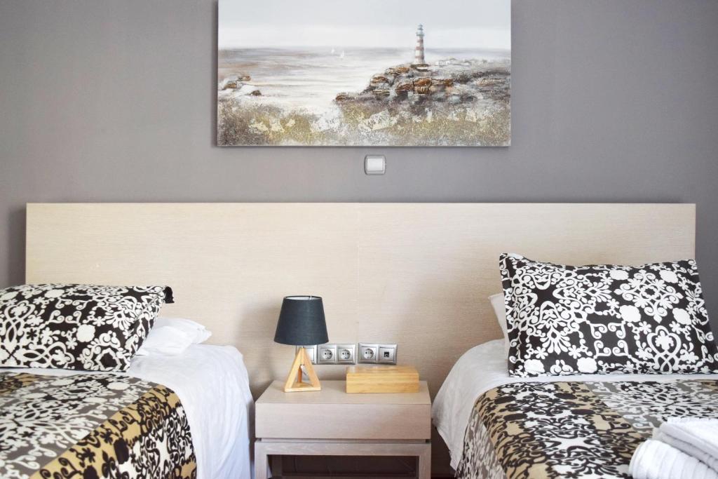 Postel nebo postele na pokoji v ubytování Poseidon by Heloni Apartments