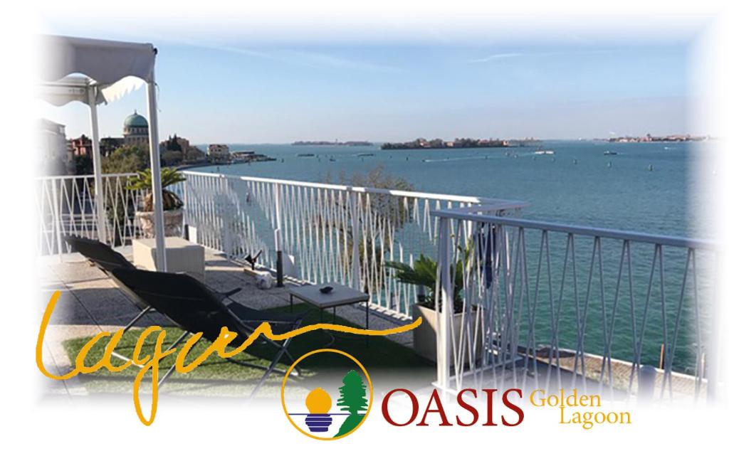 a balcony with a view of the water at OASIS Golden Lagoon Chalet in Venice-Lido
