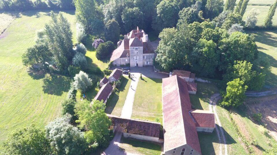 an aerial view of an old house in a field at Chateau de Vesset in Tréteau