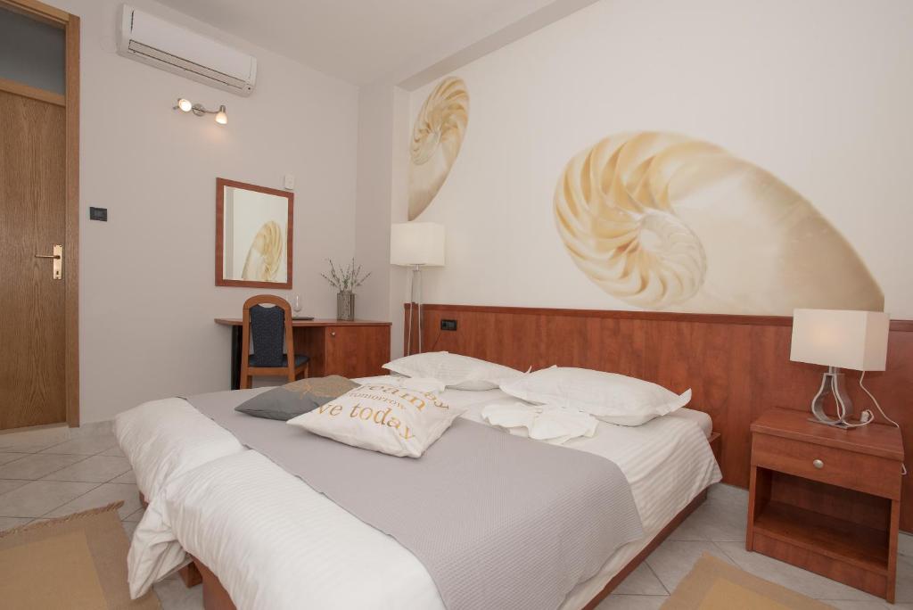 Postel nebo postele na pokoji v ubytování Villa Vinka