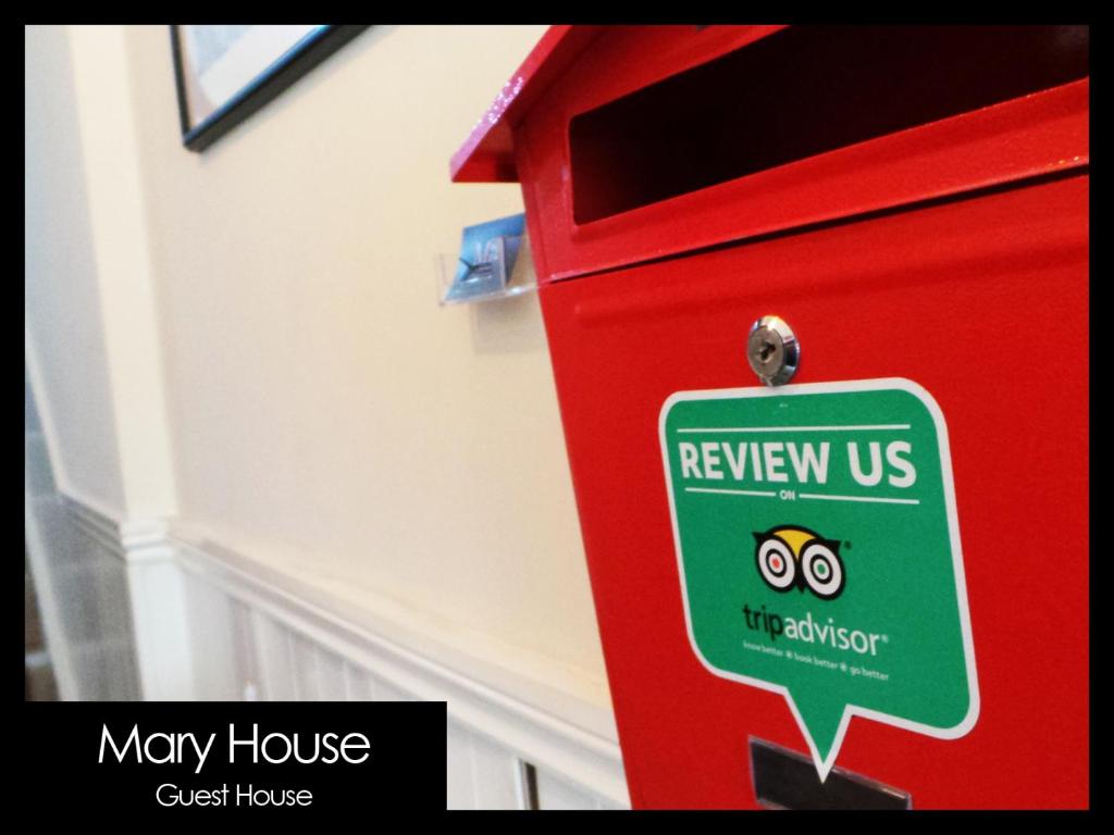 a red mail box with a new us sign on it at Mary House 46 in Porthcawl