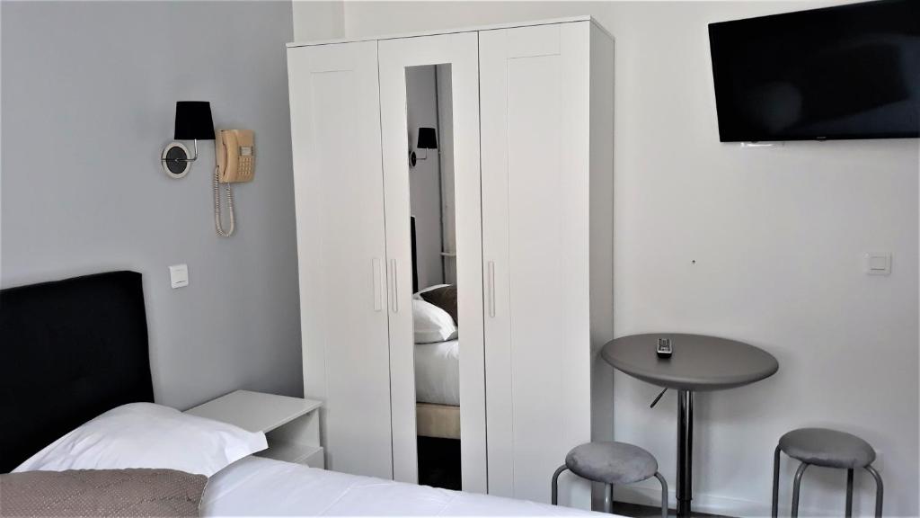 Postel nebo postele na pokoji v ubytování Hotel Le Reynita
