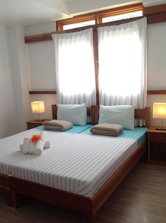 Postel nebo postele na pokoji v ubytování Pahiluna Guesthouse