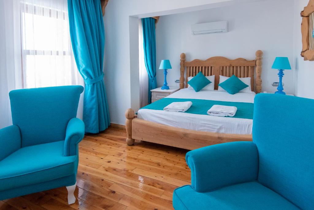 Postel nebo postele na pokoji v ubytování Elixir Hotel