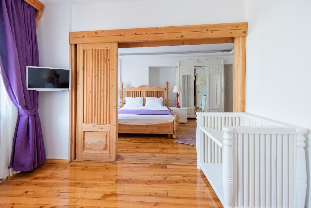Postel nebo postele na pokoji v ubytování Elixir Hotel