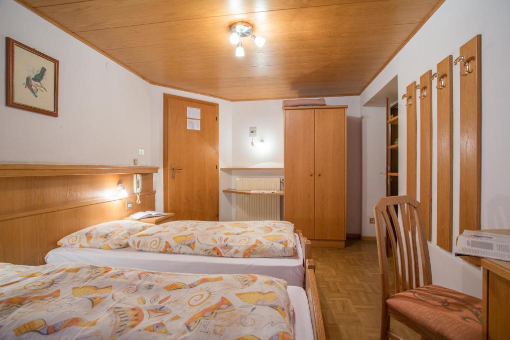 Postel nebo postele na pokoji v ubytování Gasthof Specker