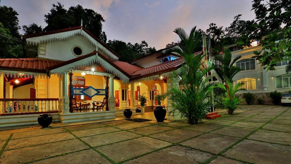 a house with a patio in front of it at Centauria Hill Resort in Ratnapura