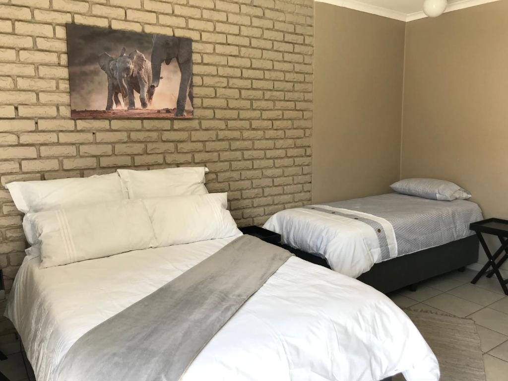 Postel nebo postele na pokoji v ubytování 4 on Sirius