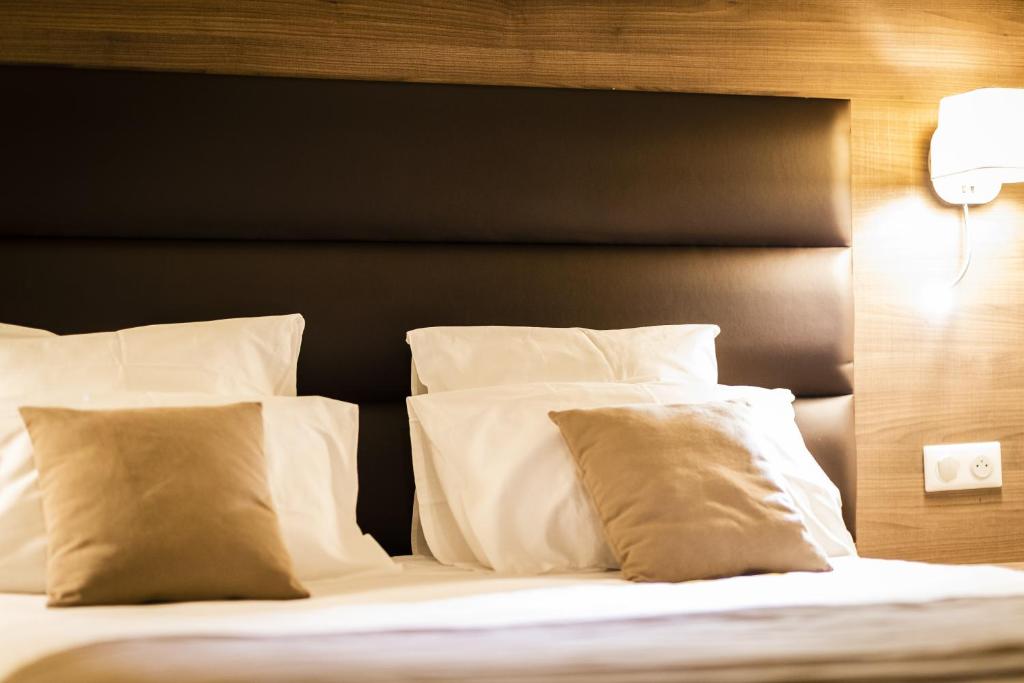 Posteľ alebo postele v izbe v ubytovaní Hôtel Bastide