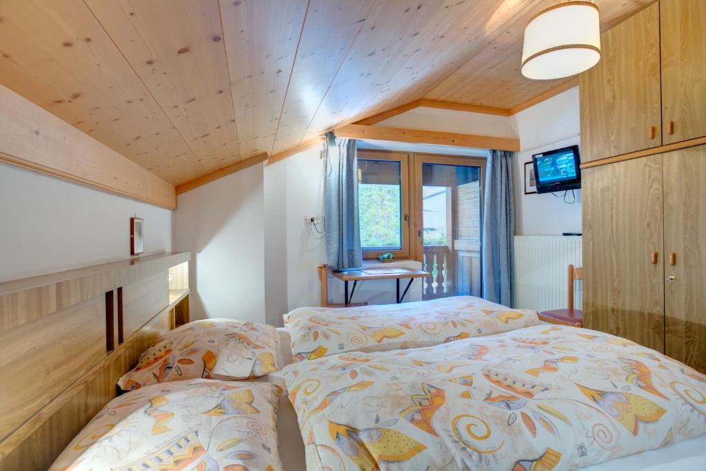 Postel nebo postele na pokoji v ubytování Gasthof Specker