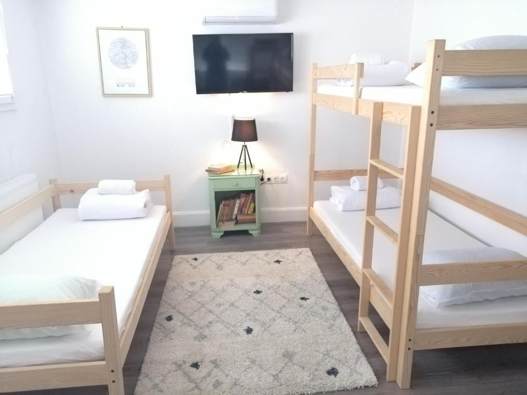 Postel nebo postele na pokoji v ubytování Hostel Eva