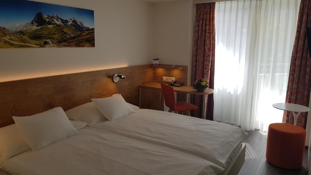 Postel nebo postele na pokoji v ubytování Hotel Bernerhof