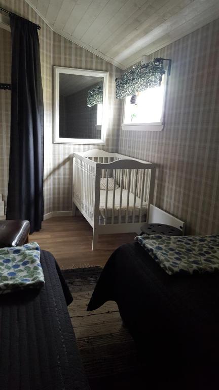 Postel nebo postele na pokoji v ubytování Gripenbergs Gårdsbutik