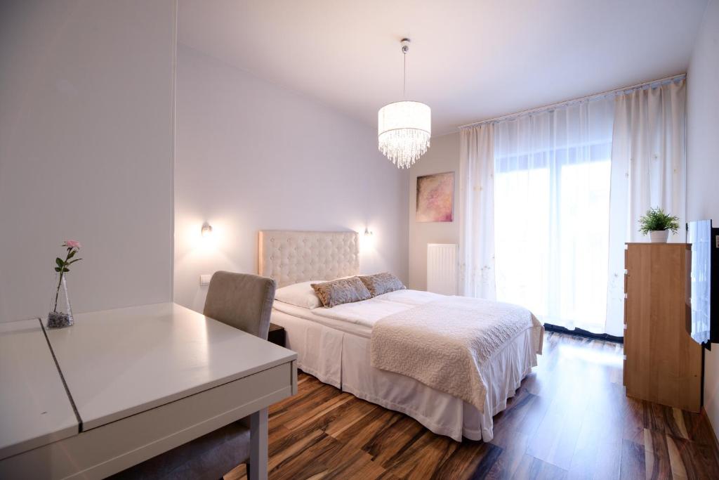 Posteľ alebo postele v izbe v ubytovaní Apartments of Pawia