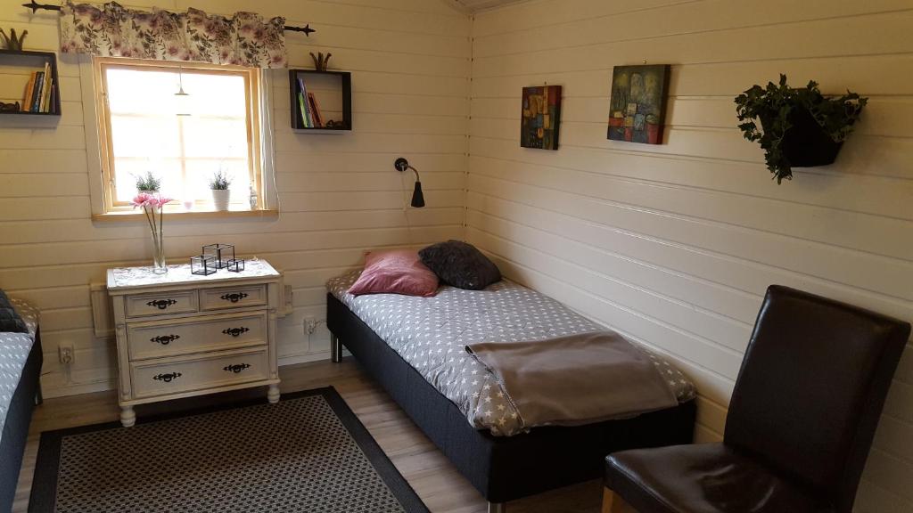 Postel nebo postele na pokoji v ubytování Gripenbergs Gårdsbutik