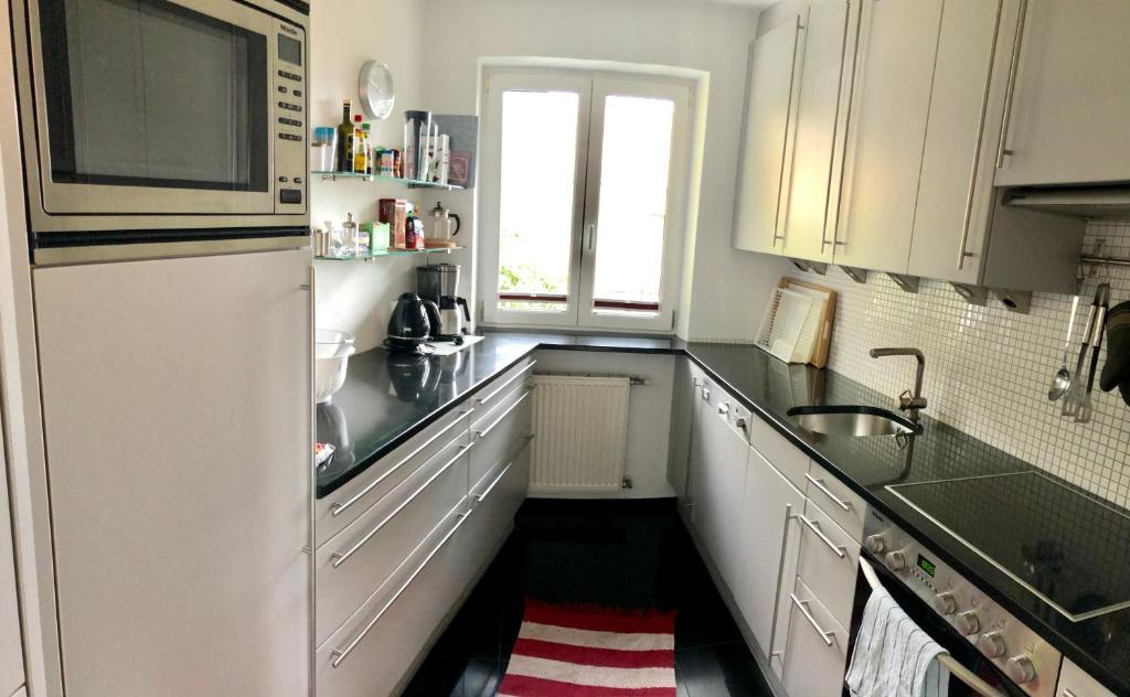 Kuchyň nebo kuchyňský kout v ubytování Ferienhaus am See