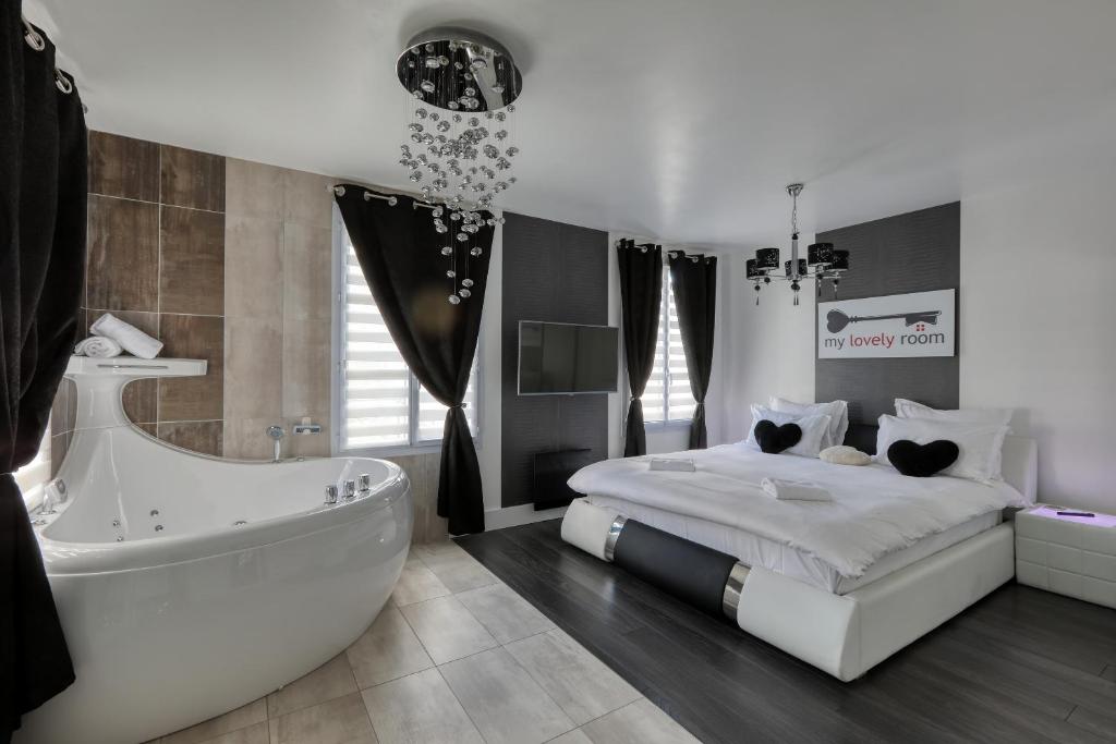 מיטה או מיטות בחדר ב-123home-Suite & spa