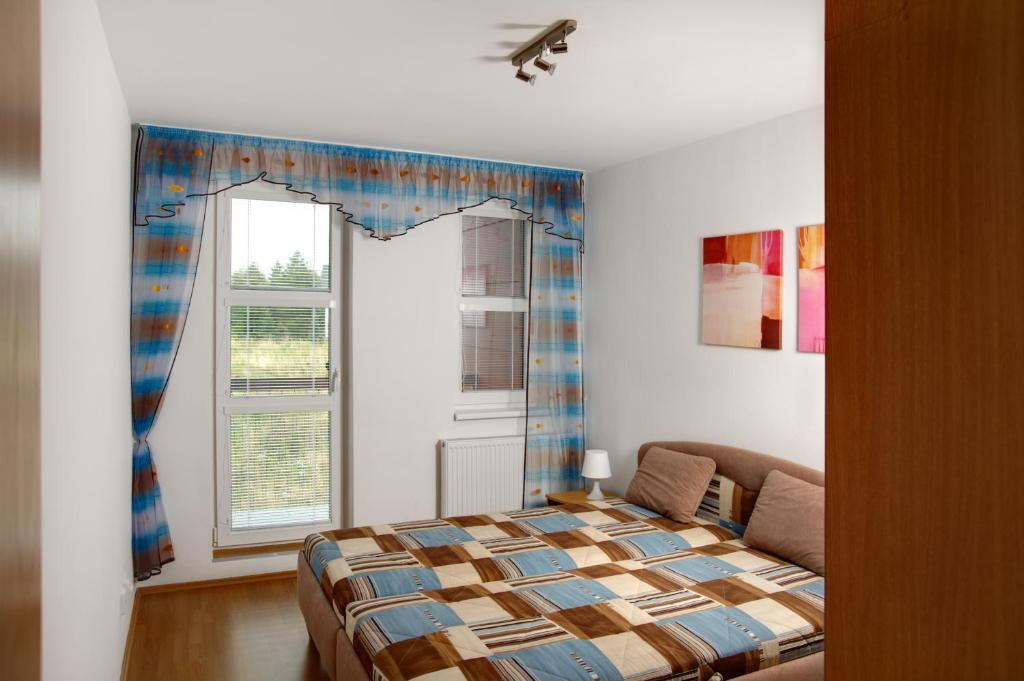 Postel nebo postele na pokoji v ubytování Apartmány KLÍNOVEC - Apartment KEILBERG
