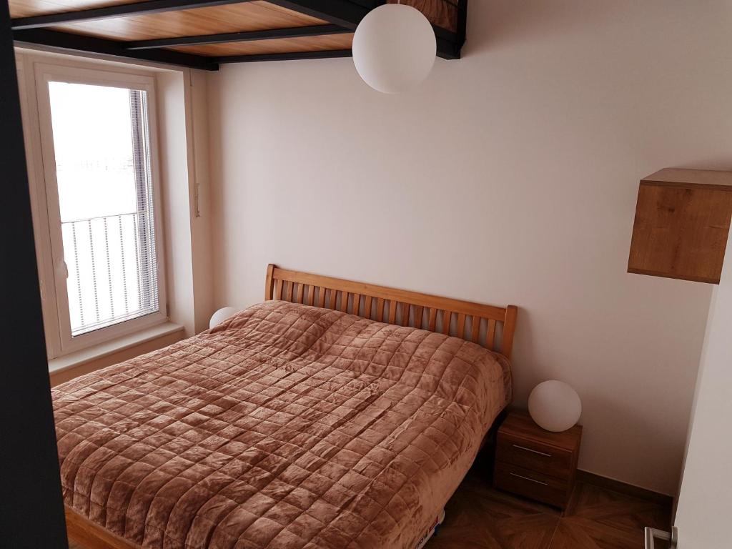 Postel nebo postele na pokoji v ubytování G.apartment's Klínovec
