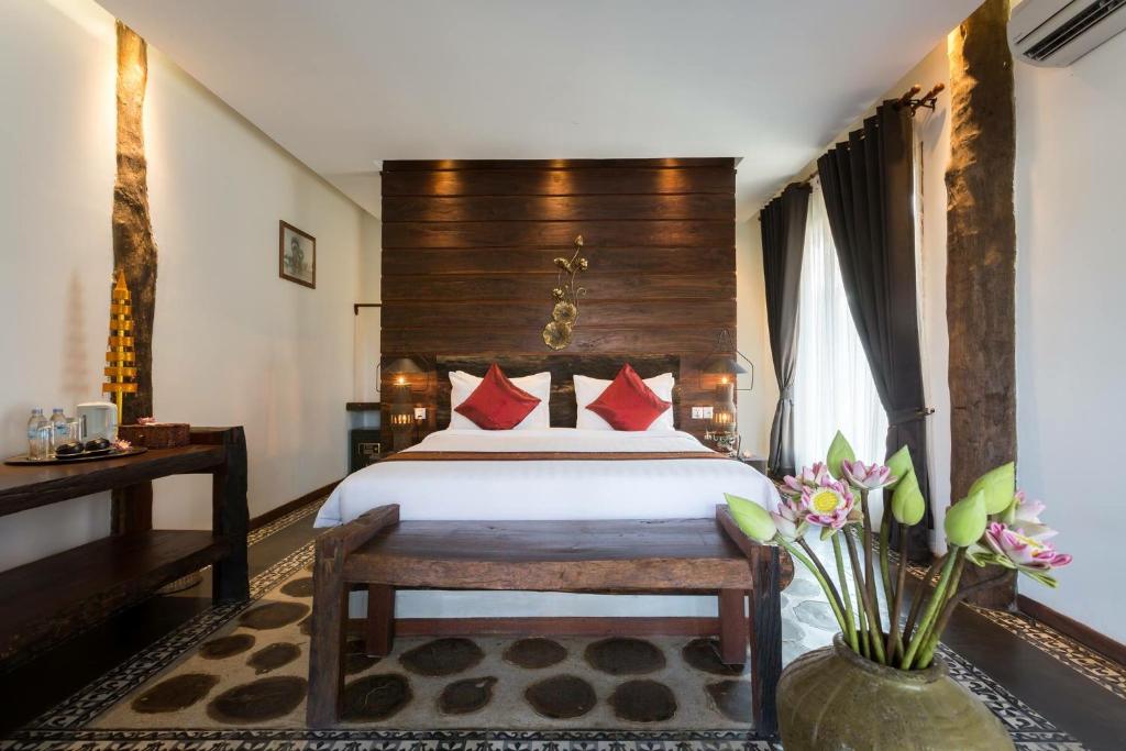 Postel nebo postele na pokoji v ubytování Khmer Paradise Villa