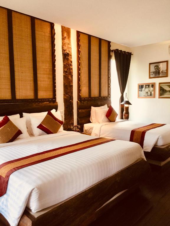 Postel nebo postele na pokoji v ubytování Khmer Paradise Villa