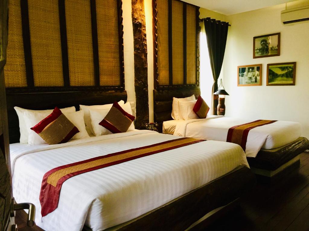 Postel nebo postele na pokoji v ubytování Khmer Paradise Villa
