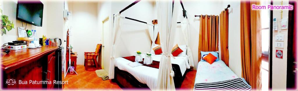 Postel nebo postele na pokoji v ubytování Bua Patumma Resort
