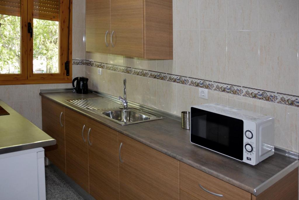 Kuchyň nebo kuchyňský kout v ubytování Apartamentos Casa-Patio Las Palmeras