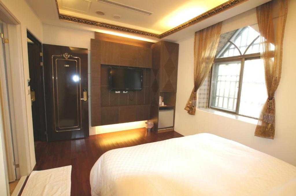 Letto o letti in una camera di Xiu Feng