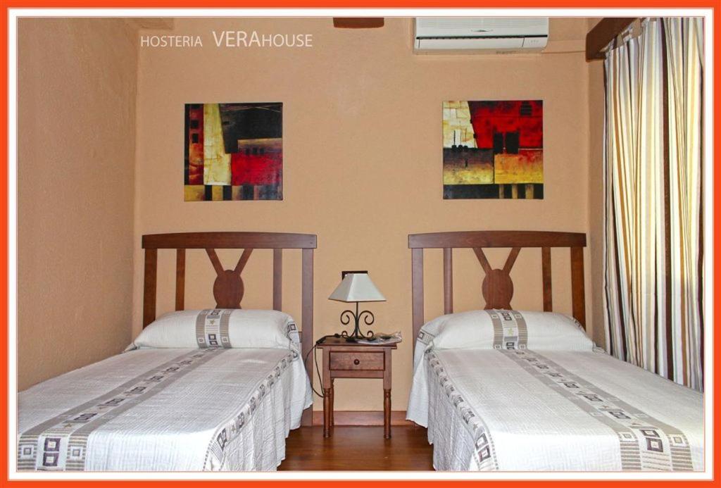 Postel nebo postele na pokoji v ubytování Hosteria Verahouse