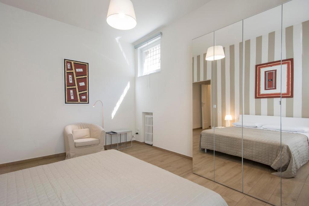 Postel nebo postele na pokoji v ubytování Piazza Paradiso Accommodation