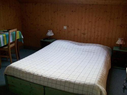 Postel nebo postele na pokoji v ubytování Hotel Les Sapins