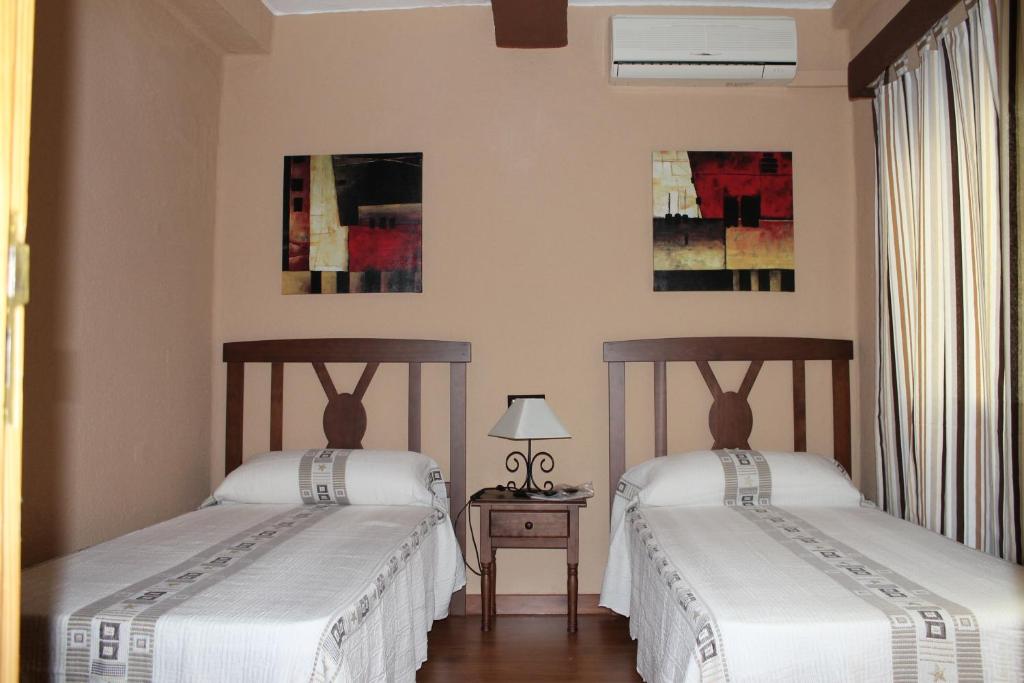Postel nebo postele na pokoji v ubytování Hosteria Verahouse