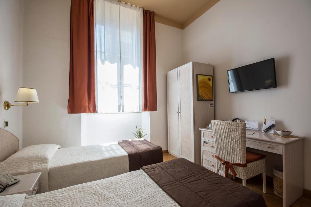 Postel nebo postele na pokoji v ubytování Piazza Paradiso Accommodation