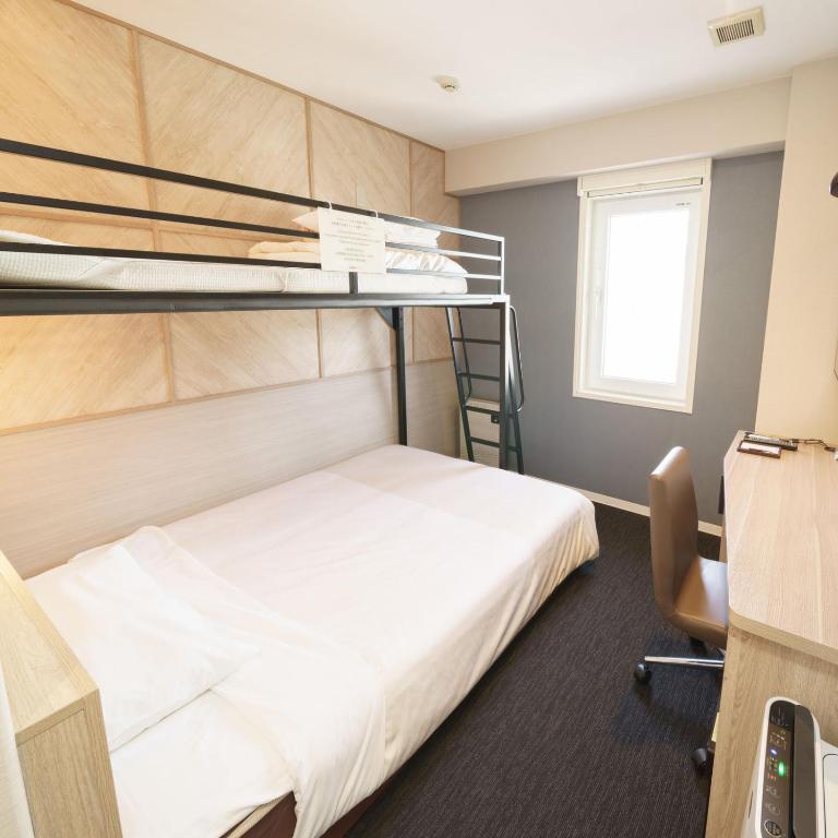 Postel nebo postele na pokoji v ubytování Super Hotel Hida Takayama