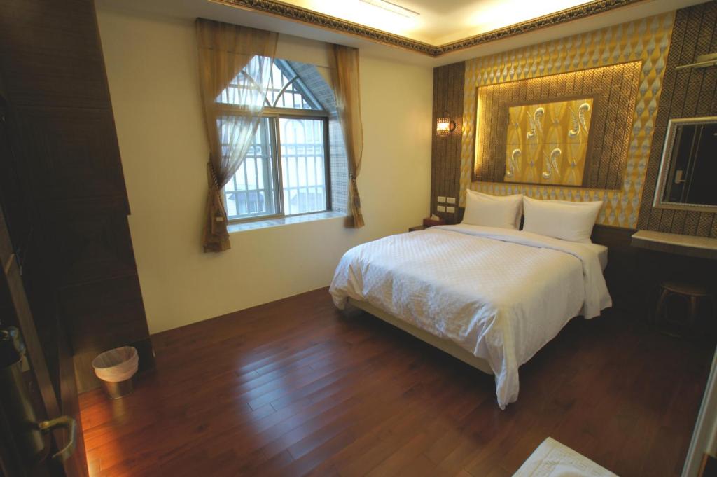 Letto o letti in una camera di Xiu Feng