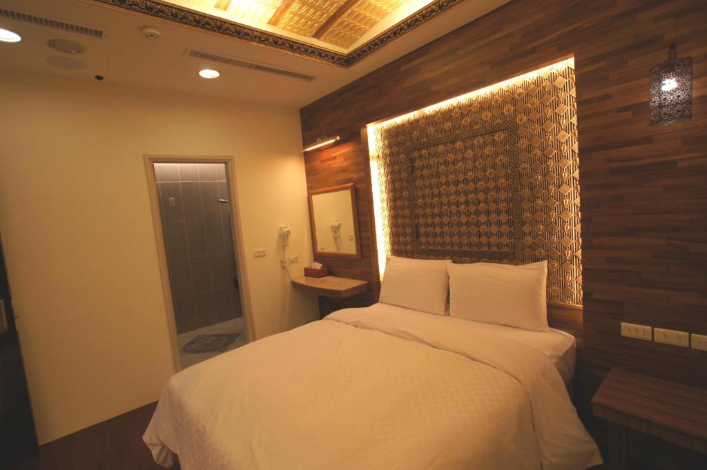 Letto o letti in una camera di Xiu Feng