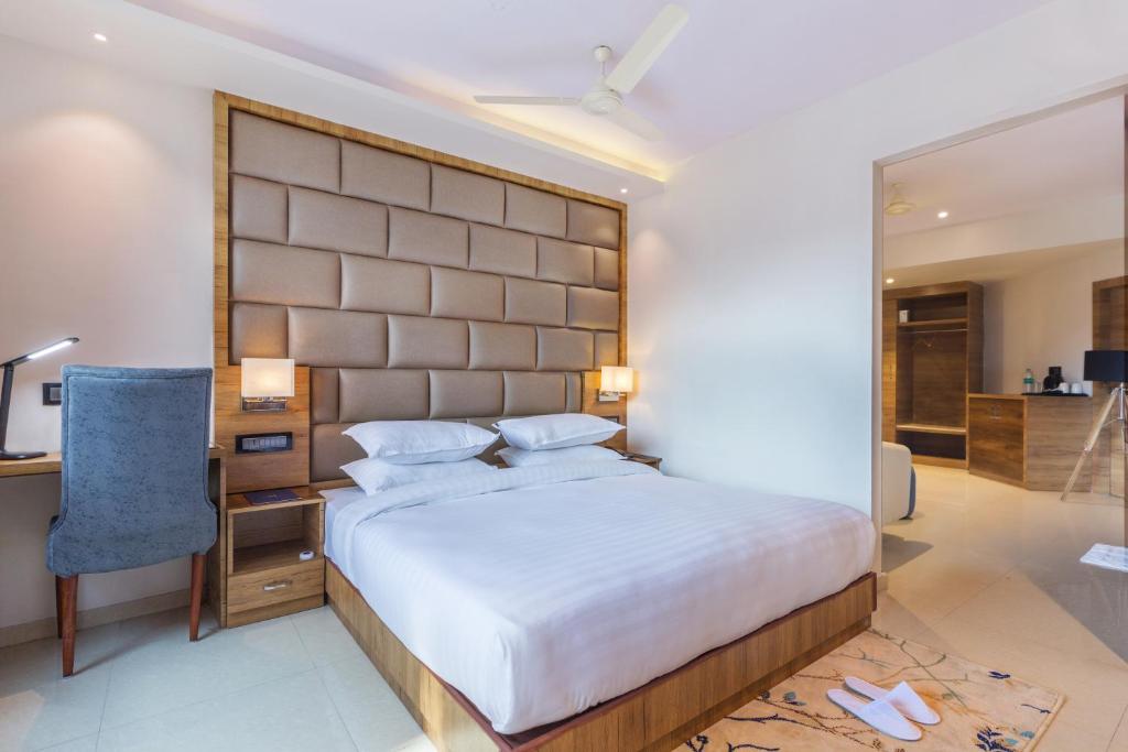 Postel nebo postele na pokoji v ubytování Aura One Hotel