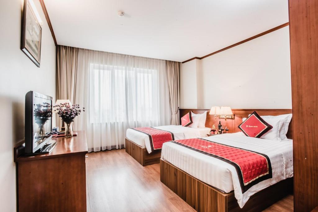 Postel nebo postele na pokoji v ubytování S79 Sunny Hotel 2