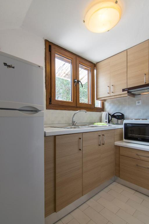 Kuchyň nebo kuchyňský kout v ubytování Natsios Apartments