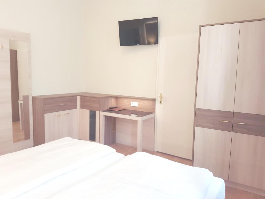 Postel nebo postele na pokoji v ubytování Hotel Haydn