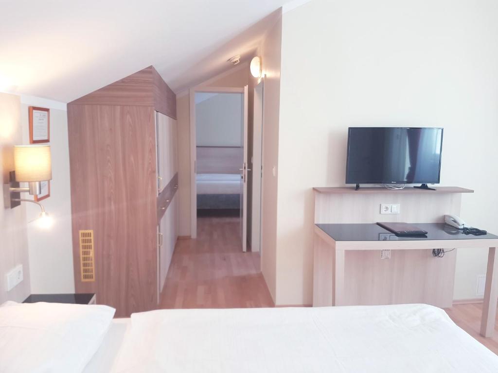Postel nebo postele na pokoji v ubytování Hotel Haydn
