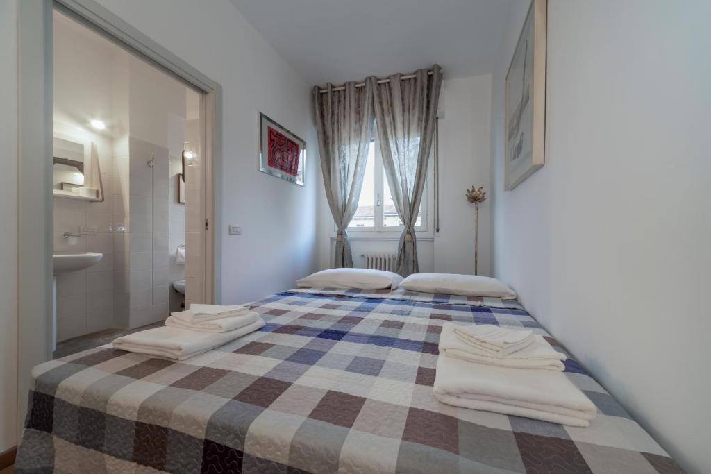 Posteľ alebo postele v izbe v ubytovaní Casa da Suite Classica