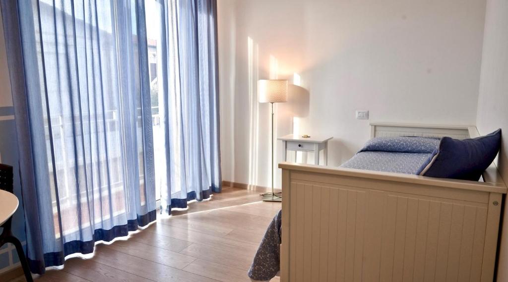Postel nebo postele na pokoji v ubytování Petit Hotel