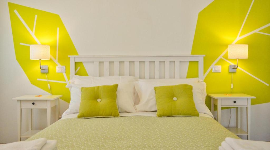 Postel nebo postele na pokoji v ubytování Petit Hotel