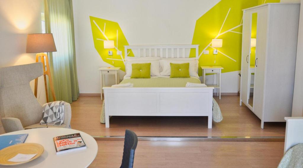 Postel nebo postele na pokoji v ubytování Petit Hotel